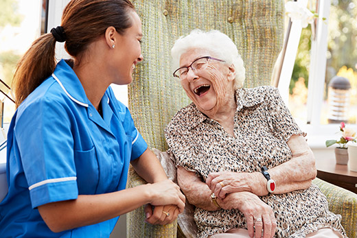 Share the gift of gratitude Woman laughing with a nurse,