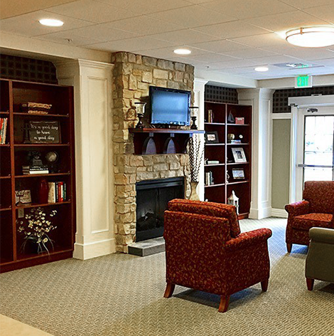 Good Samaritan Society - Fairfield Glade Assisted Living lounge with fireplace.
