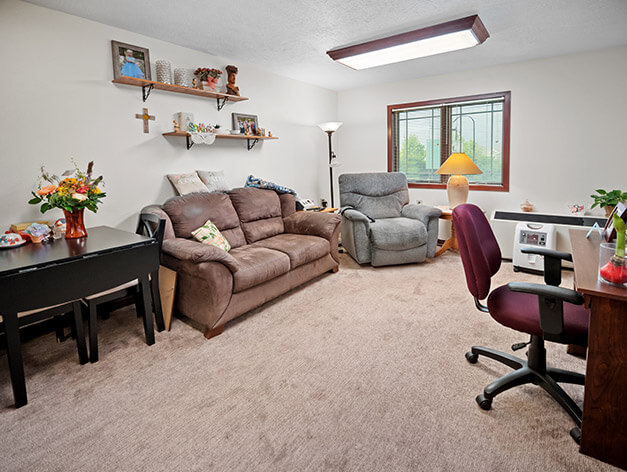 Living room in Crane Meadows Assisted Living apartment at Good Samaritan Society - Grand Island Village