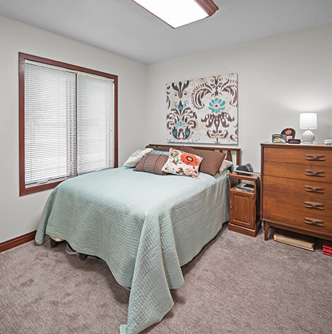 Bedroom in Crane Meadows Assisted Living apartment at Good Samaritan Society - Grand Island Village