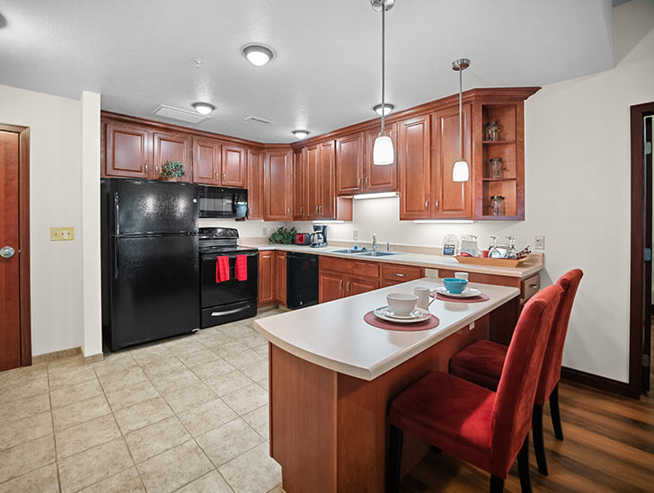 Kitchen in Pelican Falls Independent Living apartment at Good Samaritan Society - Grand Island Village