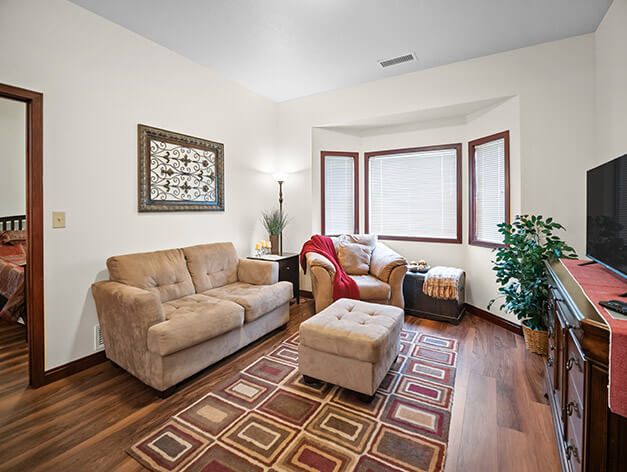 Living room in Pelican Falls Independent Living apartment at Good Samaritan Society - Grand Island Village