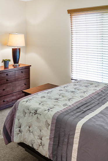 River's Edge independent living apartments feature spacious bedrooms at Good Samaritan Society - International Falls in International Falls, Minnesota.