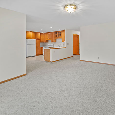 Independent living duplexes offer a nice large living room with natural light at Good Samaritan Society - Jackson in Jackson, Minnesota.