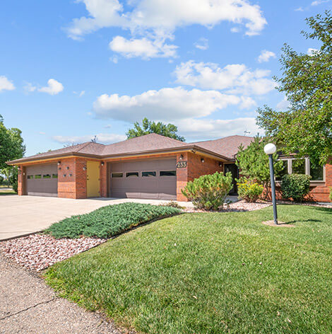 Independent Living twin home exterior with garage at Good Samaritan Society - Loveland Village in Colorado.