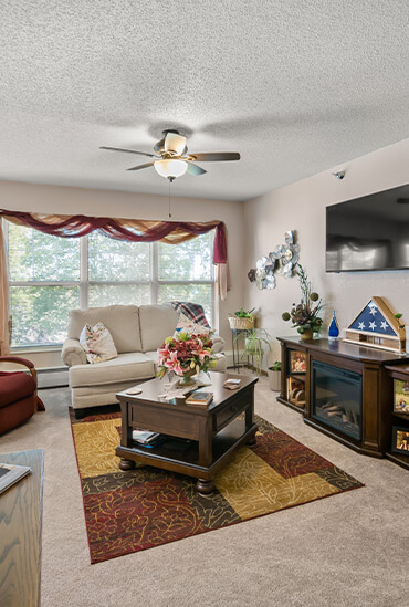 Living room in the independent living apartment at Good Samaritan Society - Windom