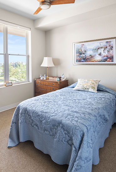 Assisted living bedroom at Good Samaritan Society - Water Valley Senior Living Resort
