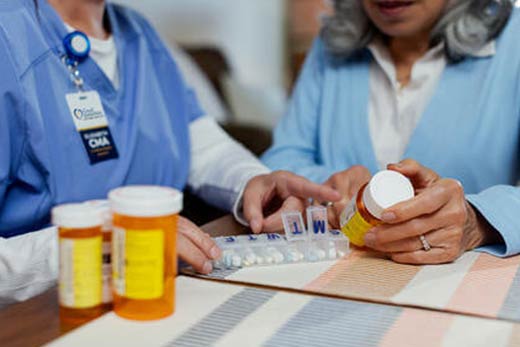 Provider and patient looking at prescription