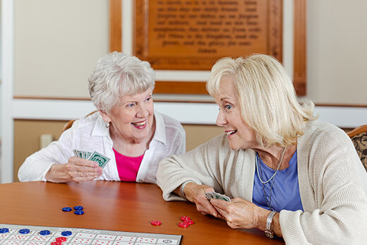 Say hello to the possibilities Two women playing a card game