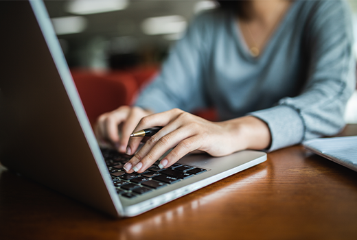 Requesting Your Medical Records Woman typing on a computer.