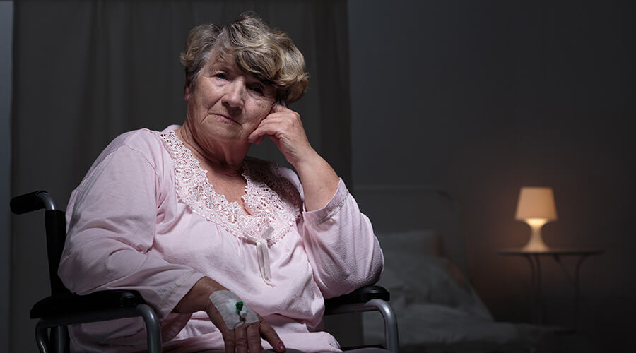 Woman in wheelchair experiencing seasonal affective disorder