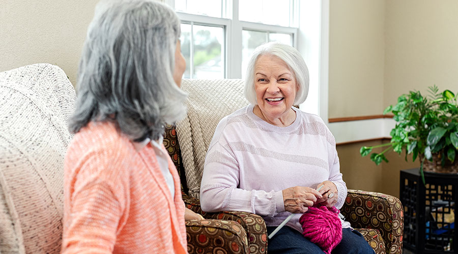 Women knitting in chairs