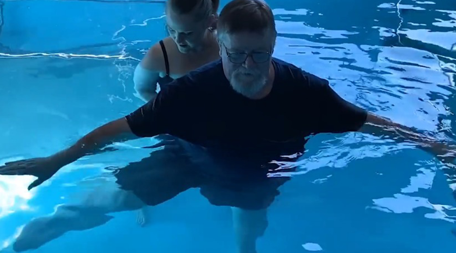 Bob Nault and physical therapist, Amanda Worsham doing aquatic therapy at Good Samaritan Society - Mountain Home in Mountain Home, Arkansas