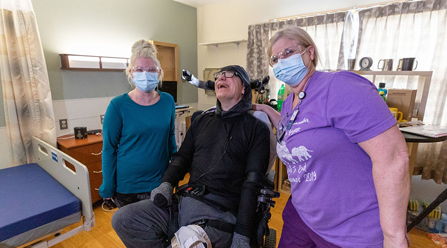 Matt Conaway with two nursing assistants