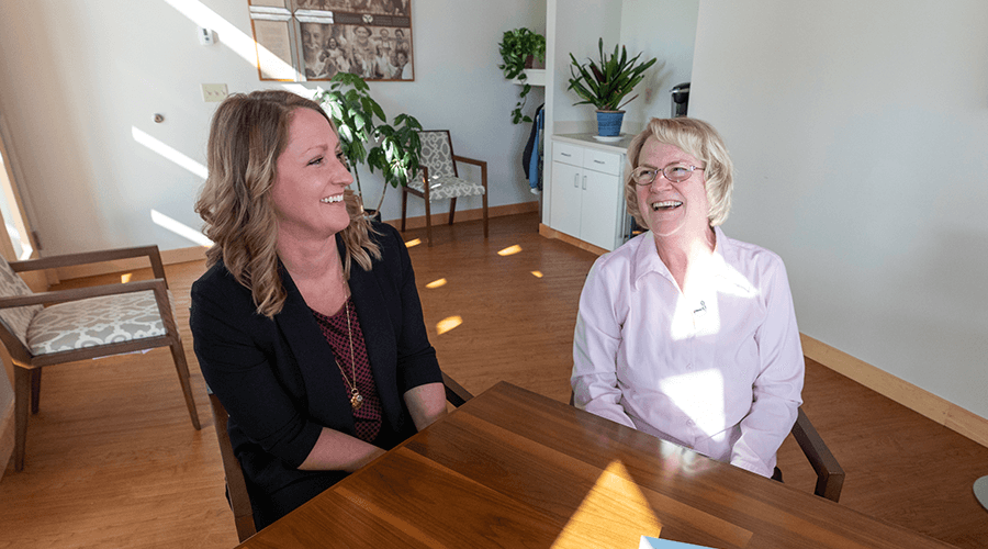 Rochelle Rindels and Nancy Van Dam sitting at a table